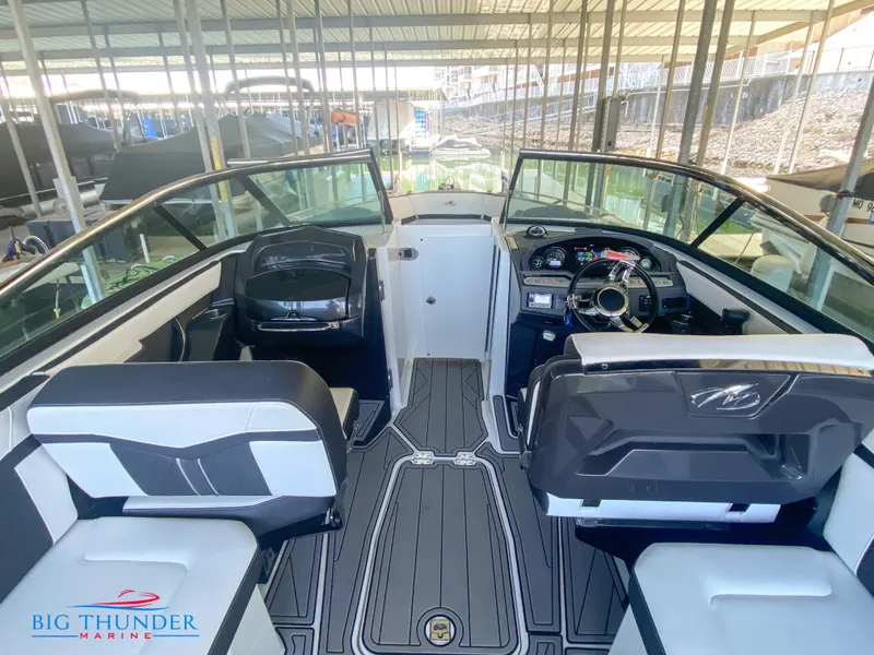Slide: The Image of 2021 Monterey 278SS boat interior with dual captain's chairs and modern dashboard. - 27