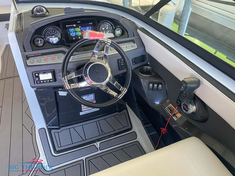 Slide: The Image of 2021 Monterey 278SS boat dashboard with steering wheel and control panel. - 29