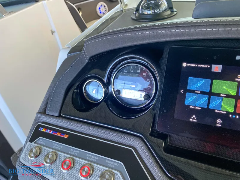 Slide: The Image of 2021 Monterey 278SS boat dashboard with gauges and touchscreen controls. - 31