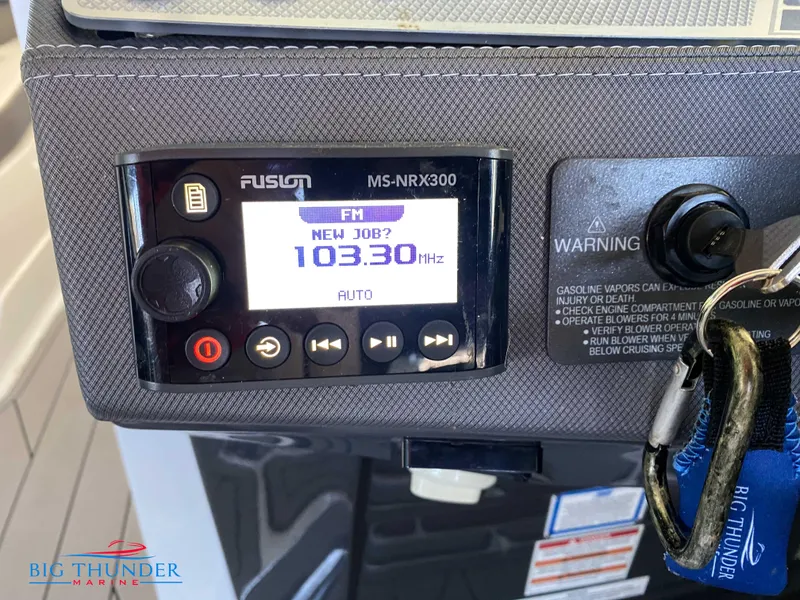 Slide: The Image of Fusion MS-NRX300 radio on 2021 Monterey 278SS boat dashboard, tuned to 103.3 FM. - 37