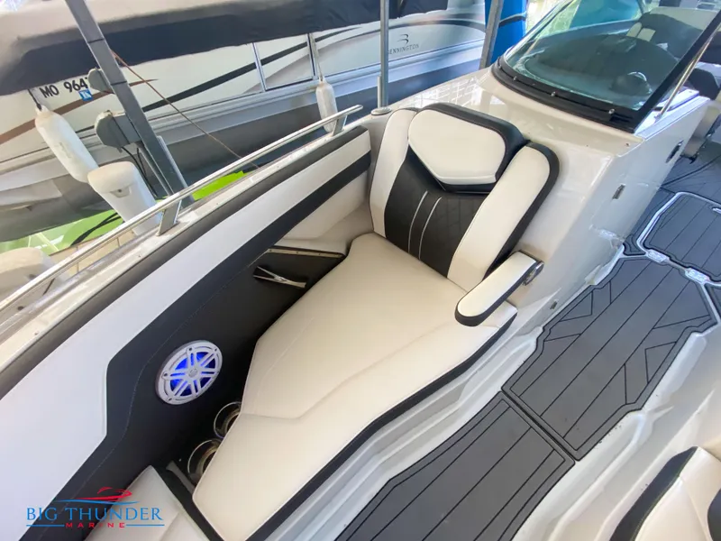 Slide: The Image of 2021 Monterey 278SS boat interior with white and black seating, and marine speaker. - 46