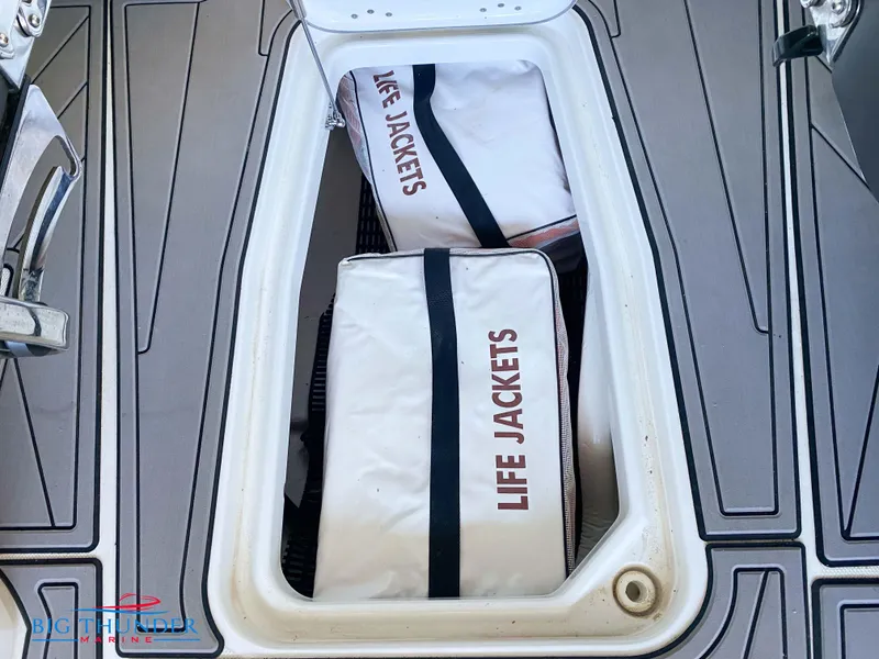 Slide: The Image of 2021 Monterey 278SS boat storage compartment with life jackets. - 49