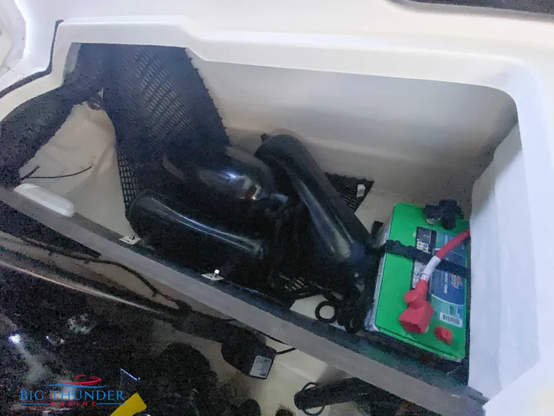 Slide: The Image of Storage compartment of a 2021 Monterey 278SS boat with battery and equipment. - 52