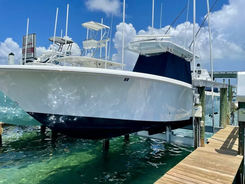 Slide: The Image of 2020 Invincible 36' Open Fisherman boat docked on a lift. - 1