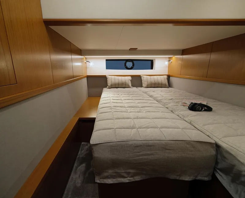 Slide: The Image of Sargo 45 Cat A 2025 boat deck with seating, table, and Finnish flag. - 13