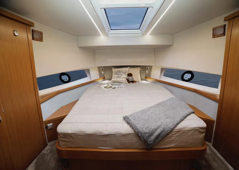 Slide: The Image of Sargo 45 Cat A 2025 boat with a cozy seating area and table on the deck. - 15