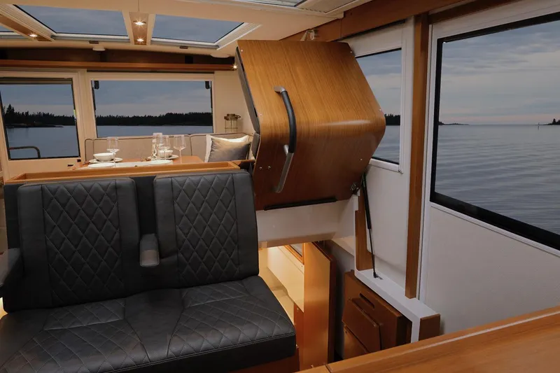 Slide: The Image of Interior of 2025 Sargo 45 Cat A boat with wooden finishes and modern design. - 26