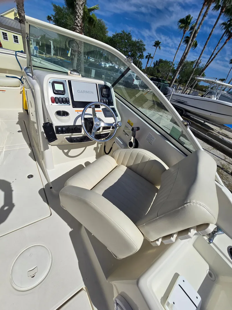 Slide: The Image of 2008 Hydra-Sports Vector 2200 DC boat interior with steering wheel and Garmin navigation system. - 11