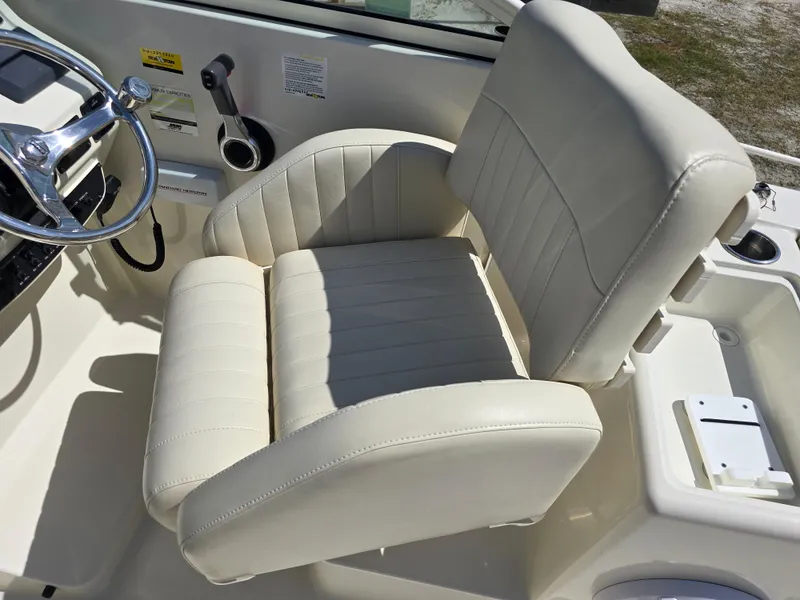 Slide: The Image of 2008 Hydra-Sports Vector 2200 DC boat interior with cream captain's chair and steering wheel. - 12
