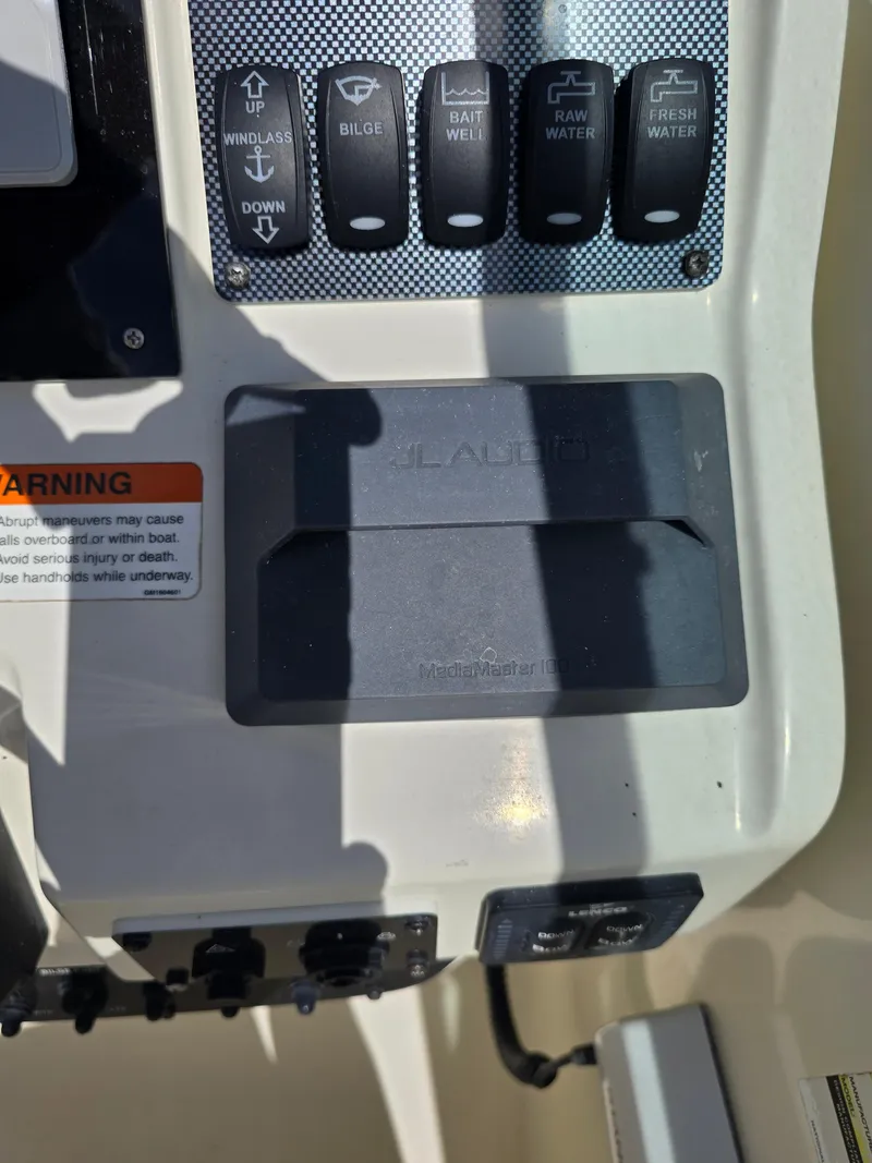 Slide: The Image of Control panel of a 2008 Hydra-Sports Vector 2200 DC boat with various switches. - 16