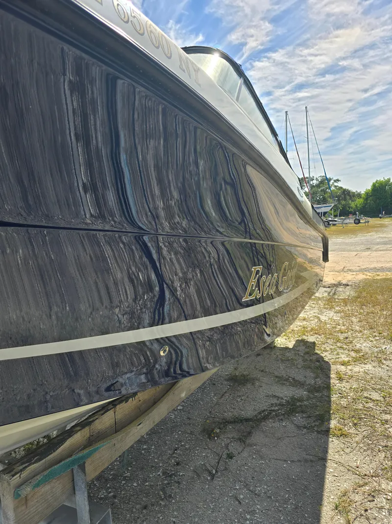 Slide: The Image of 2008 Hydra-Sports Vector 2200 DC boat on land, showcasing sleek design and glossy finish. - 39