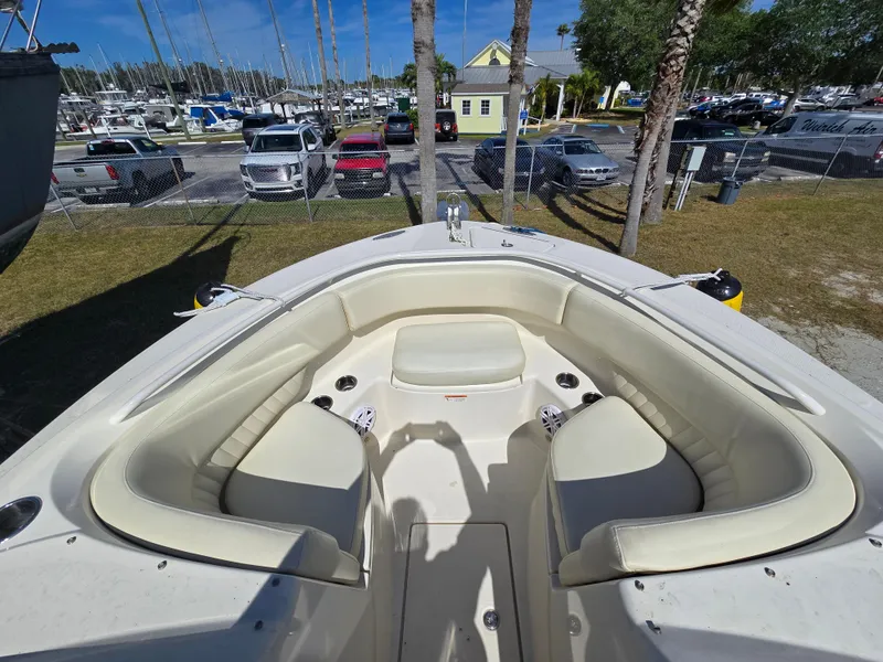 Slide: The Image of 2008 Hydra-Sports Vector 2200 DC boat with spacious seating in a marina setting. - 4