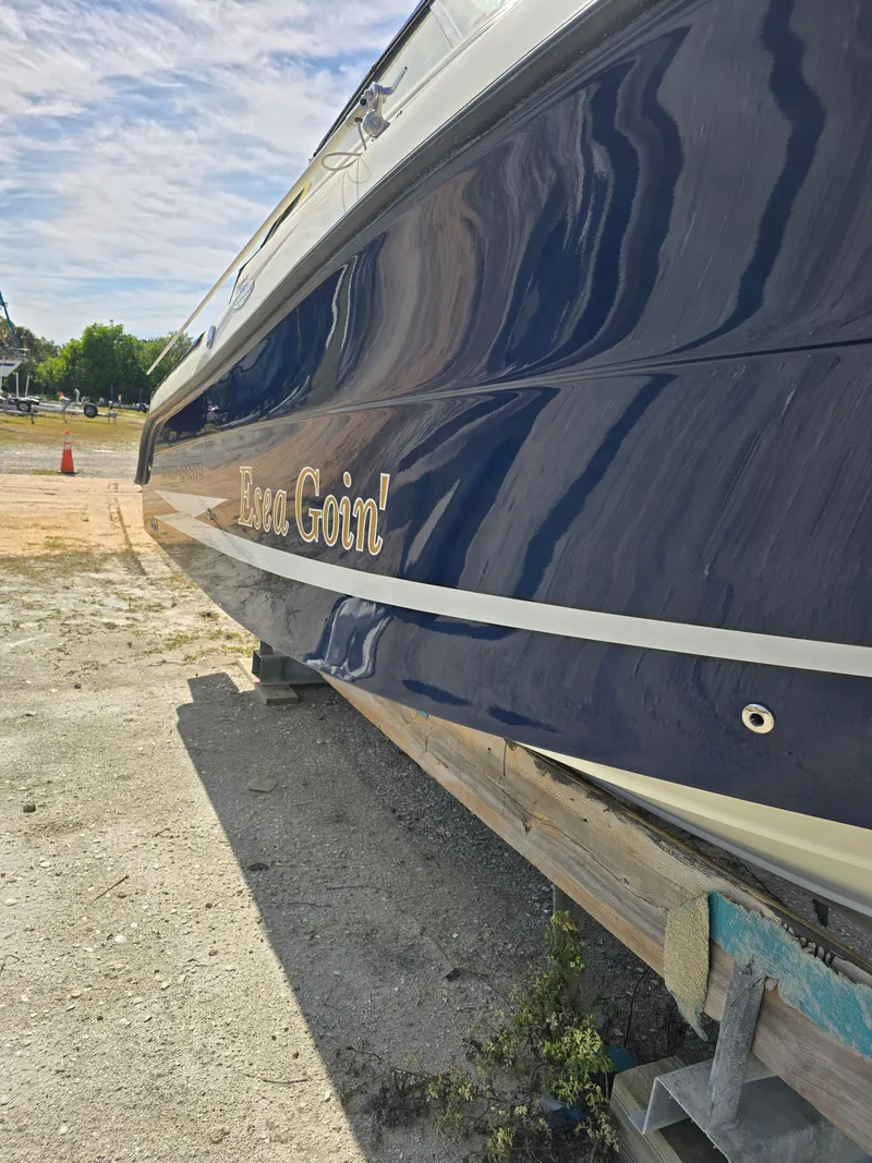 Slide: The Image of 2008 Hydra-Sports Vector 2200 DC boat on dry land, blue hull with name "Esea Goin'." - 40