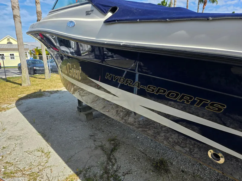 Slide: The Image of 2008 Hydra-Sports Vector 2200 DC boat on land, showcasing sleek design and branding. - 46