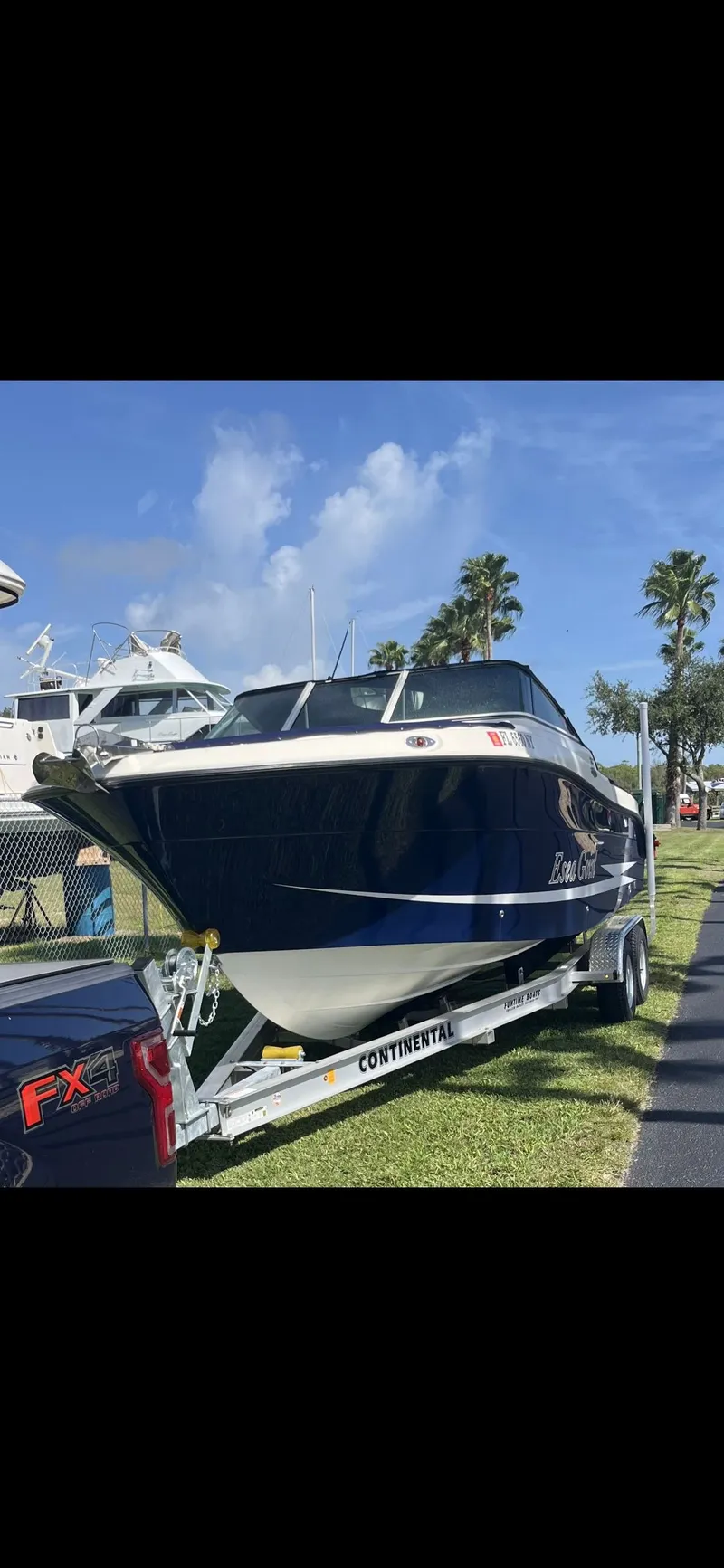 Slide: The Image of 2008 Hydra-Sports Vector 2200 DC boat on trailer, parked outdoors under blue sky. - 48