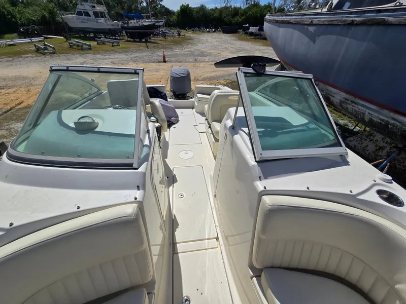Slide: The Image of 2008 Hydra-Sports Vector 2200 DC boat interior with seating and windshield, docked outdoors. - 9