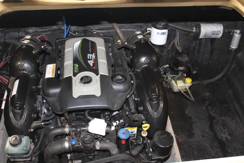 Slide: The Image of Engine compartment of a 2013 Stingray 208 CK boat. - 36