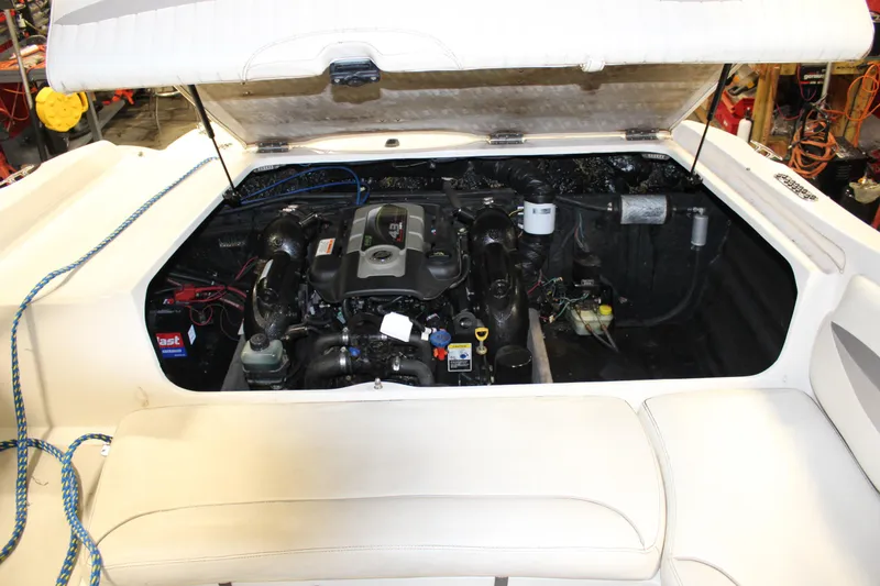 Slide: The Image of 2013 Stingray 208 CK boat engine compartment with open hatch. - 37