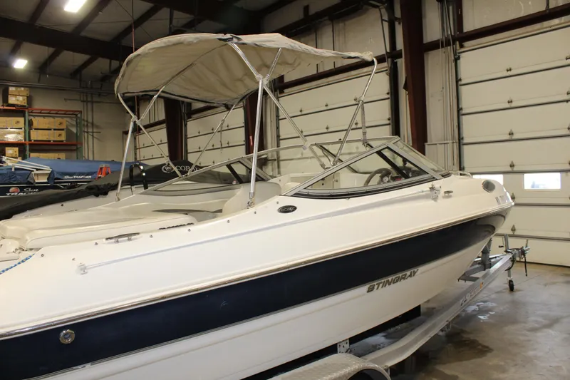 Slide: The Image of 2013 Stingray 208 CK boat in indoor storage facility. - 9