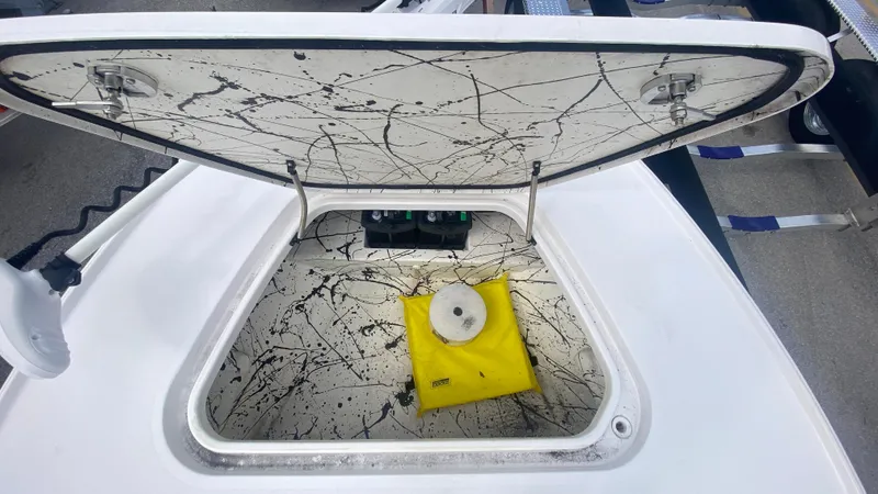 Slide: The Image of Open hatch of Piranha F2000 boat, 2025 model, with yellow bag inside. - 14