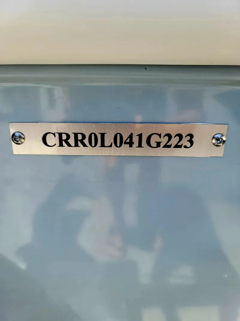 Slide: The Image of Metal plate with serial number CRR0L041G223 on Piranha F2000, 2025 model. - 26