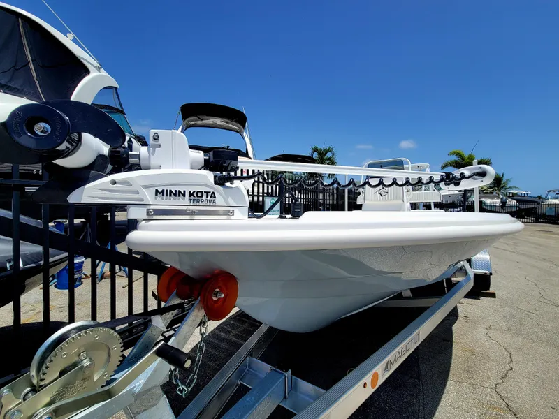 Slide: The Image of Piranha F2000 boat with Minn Kota Terrova motor on trailer, sunny day. - 29