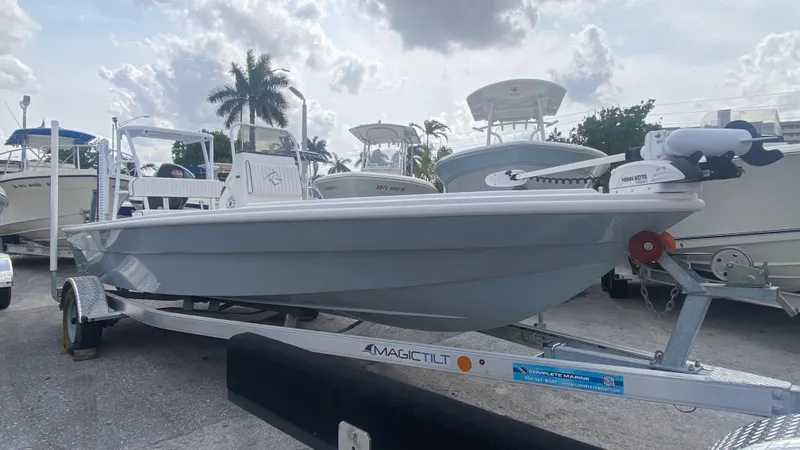 Slide: The Image of 2025 Piranha F2000 boat on trailer, parked outdoors under cloudy sky. - 30