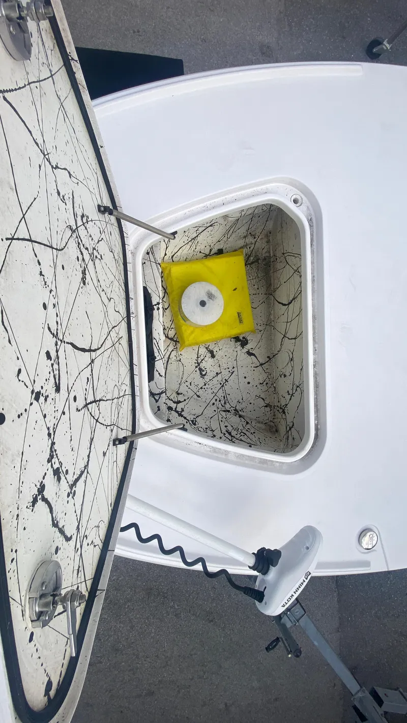 Slide: The Image of Open hatch on Piranha F2000 boat, 2025 model, with visible wiring and yellow component. - 31