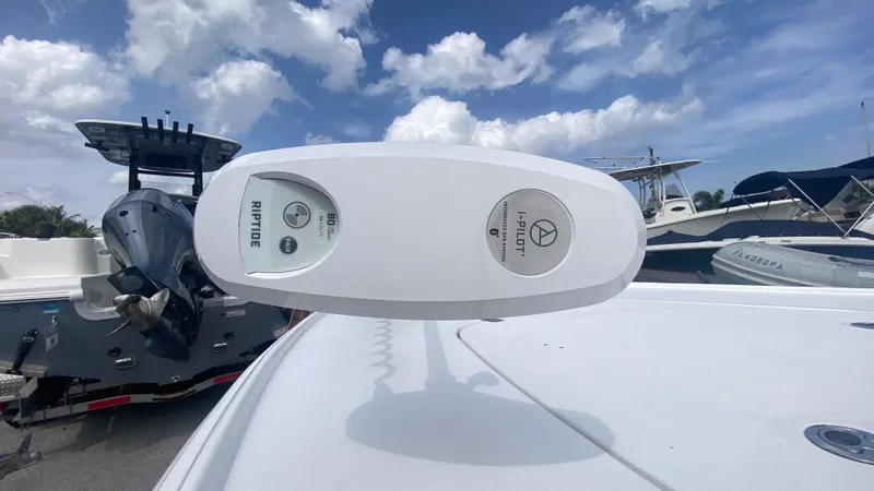Slide: The Image of Boat motor control panel on a Piranha F2000, 2025 model, under a partly cloudy sky. - 33