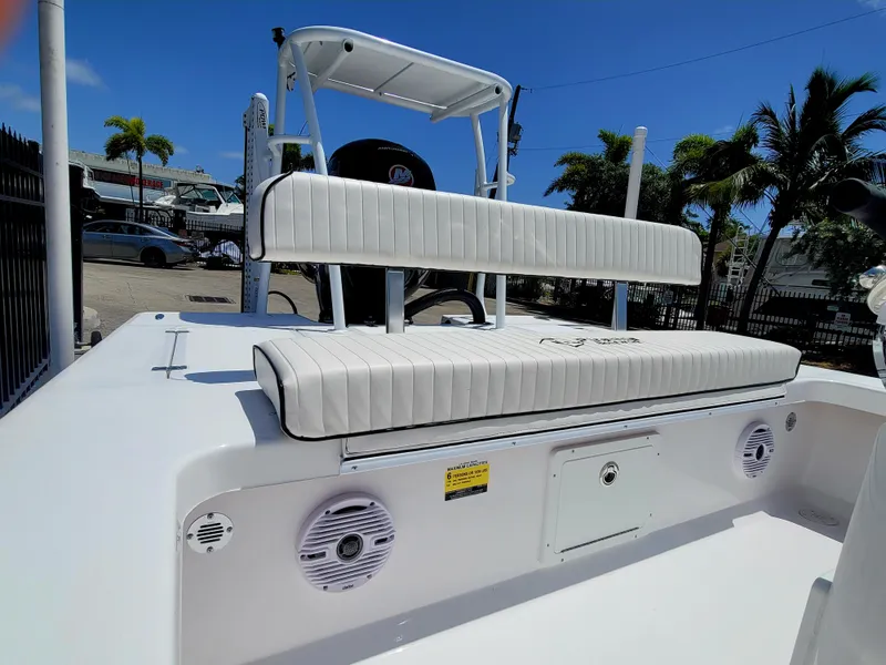 Slide: The Image of Piranha F2000 boat 2025 model with white seating and speakers, docked under clear blue sky. - 5