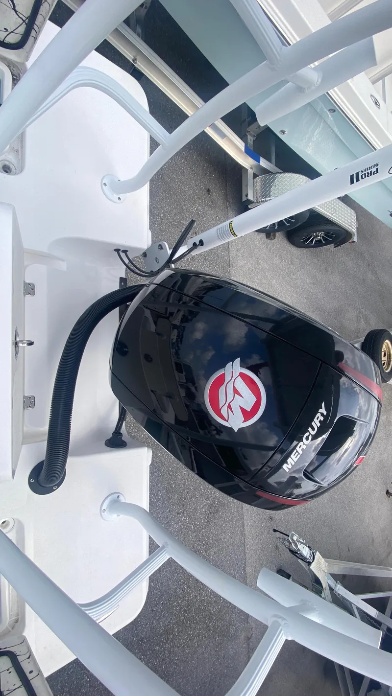 Slide: The Image of Outboard motor on a boat, Piranha F2000, 2025 model, featuring Mercury branding. - 8