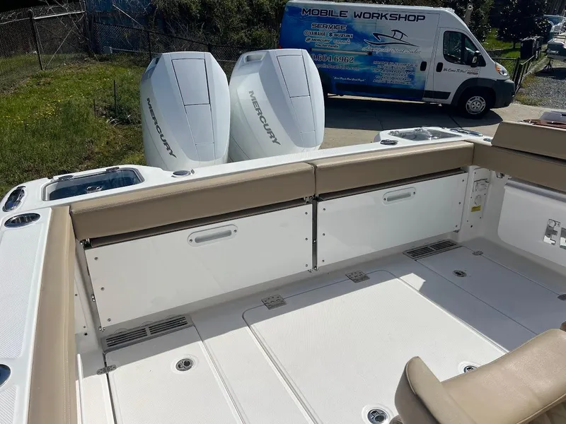 Slide: The Image of 2024 Everglades 315 Center Console boat with twin Mercury engines. - 11