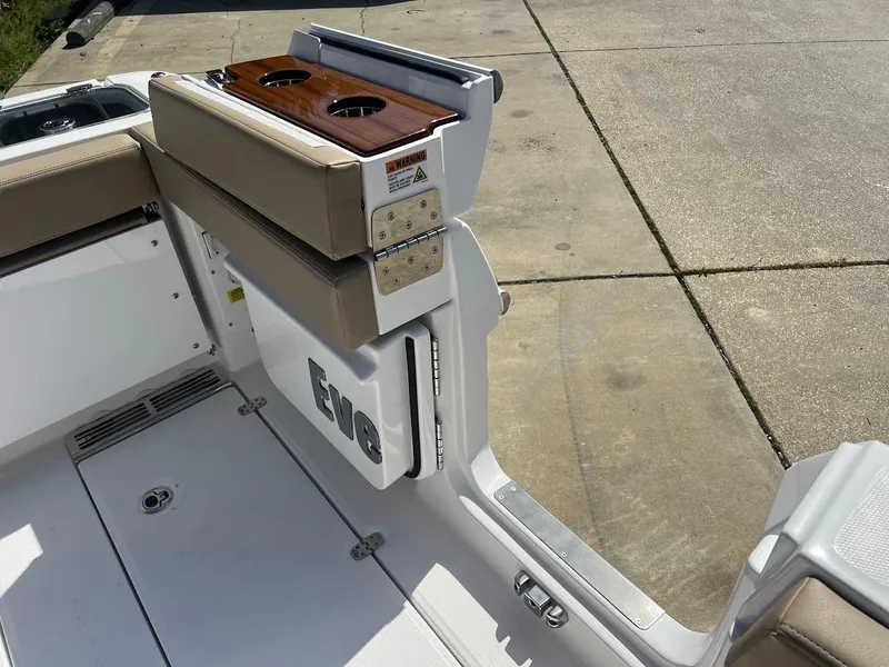 Slide: The Image of 2024 Everglades 315 Center Console boat with foldable seating and cup holders. - 13