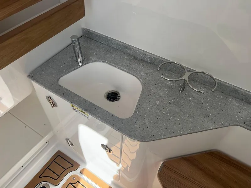Slide: The Image of 2024 Everglades 315 Center Console boat interior sink and countertop - 36