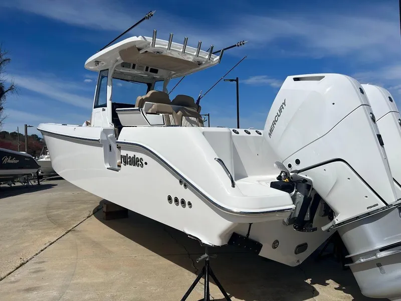 Slide: The Image of 2024 Everglades 315 Center Console boat with twin Mercury engines on display. - 4