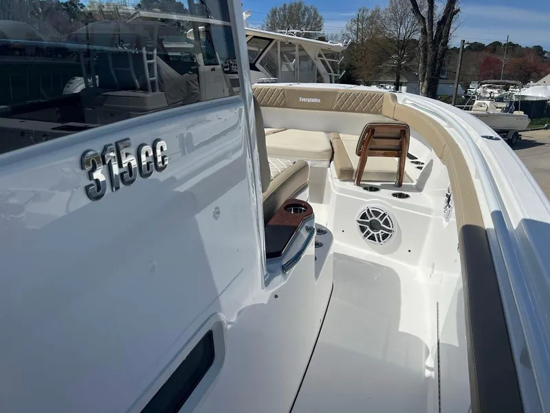 Slide: The Image of 2024 Everglades 315 Center Console boat interior with seating and speaker. - 40