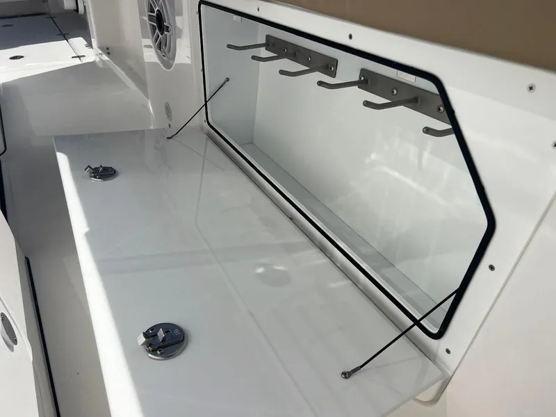 Slide: The Image of 2024 Everglades 315 Center Console fishing rod storage compartment. - 41