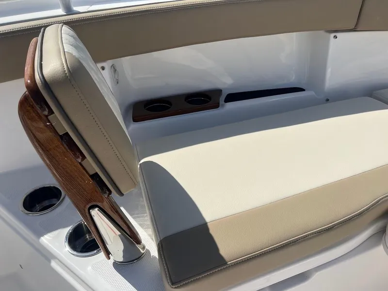 Slide: The Image of 2024 Everglades 315 Center Console boat seating area with cup holders. - 44