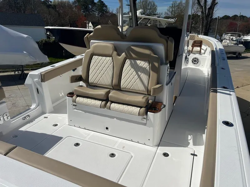 Slide: The Image of 2024 Everglades 315 Center Console boat with luxurious seating and spacious deck. - 8