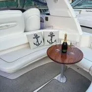 Slide: The Image of Luxurious 2002 Sea Ray 310 Sundancer interior with champagne and nautical decor. - 29
