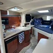 Slide: The Image of Interior of 2002 Sea Ray 310 Sundancer with cozy cabin and kitchenette. - 31