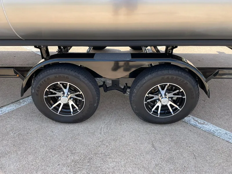 Slide: The Image of 2024 Barletta Cabrio 22UC trailer wheels and tires on pavement. - 19