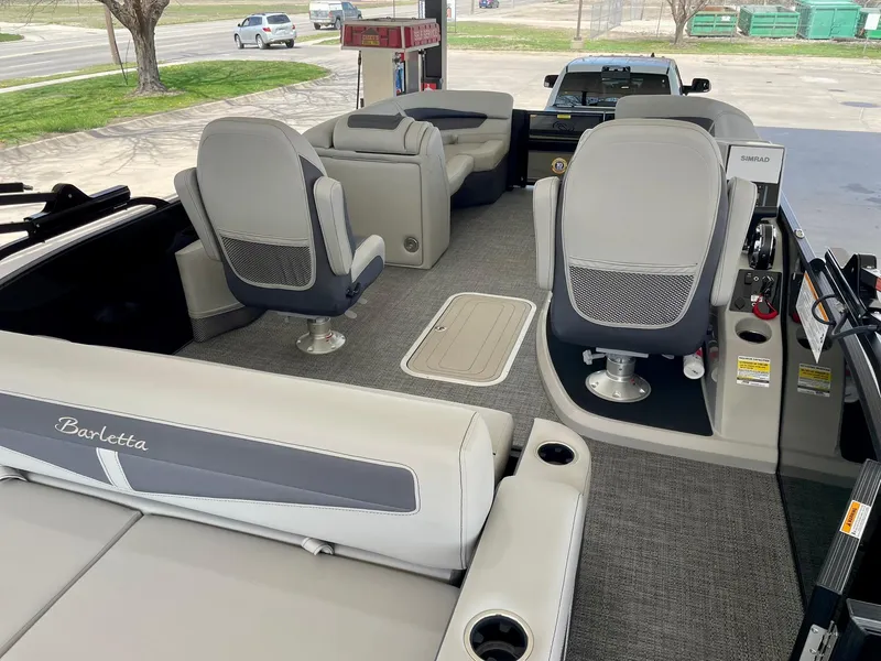 Slide: The Image of 2024 Barletta Cabrio 22UC pontoon boat interior with plush seating and modern design. - 22