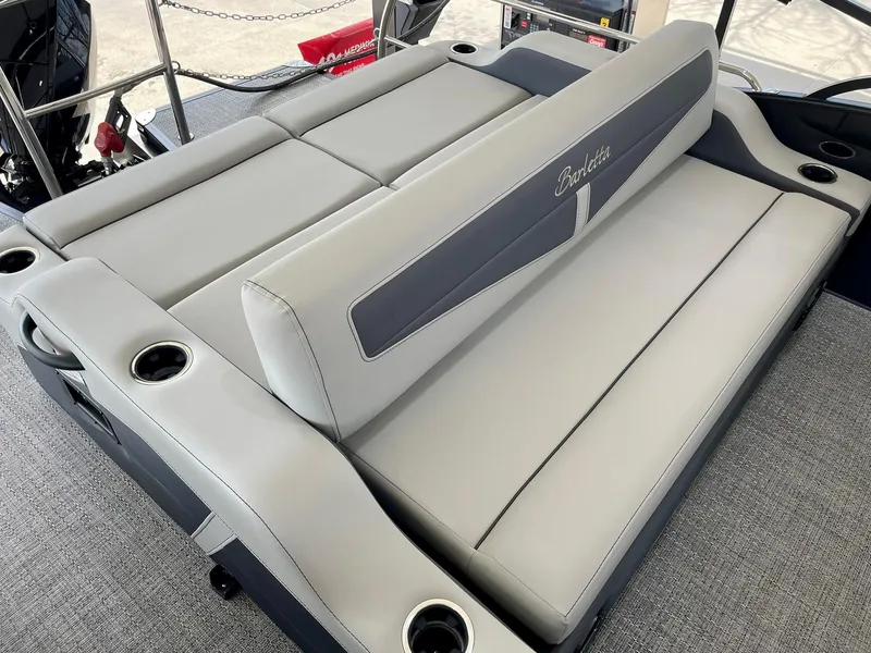 Slide: The Image of 2024 Barletta Cabrio 22UC boat interior seating with cup holders. - 24