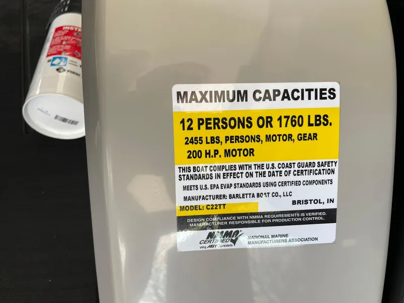 Slide: The Image of 2024 Barletta Cabrio 22UC maximum capacities label: 12 persons or 1760 lbs, 200 HP motor. - 28