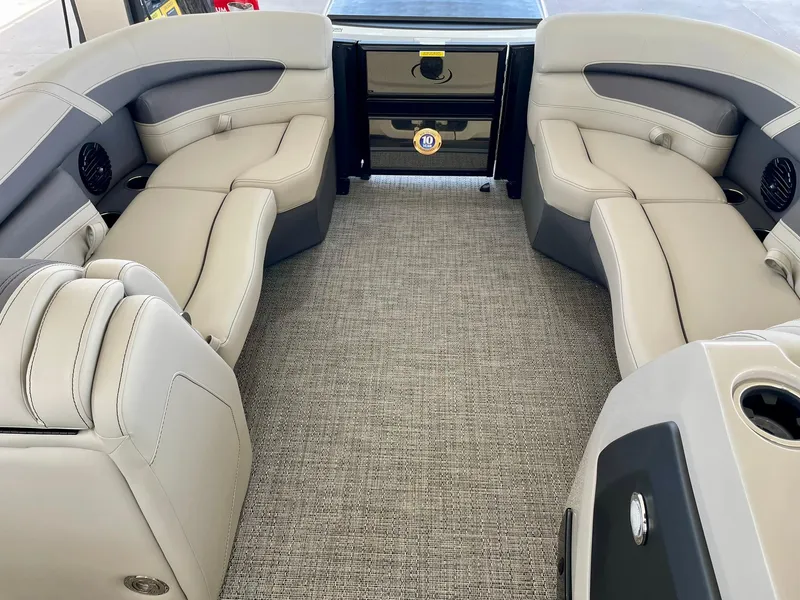 Slide: The Image of 2024 Barletta Cabrio 22UC boat interior with luxurious seating and carpeted flooring. - 29