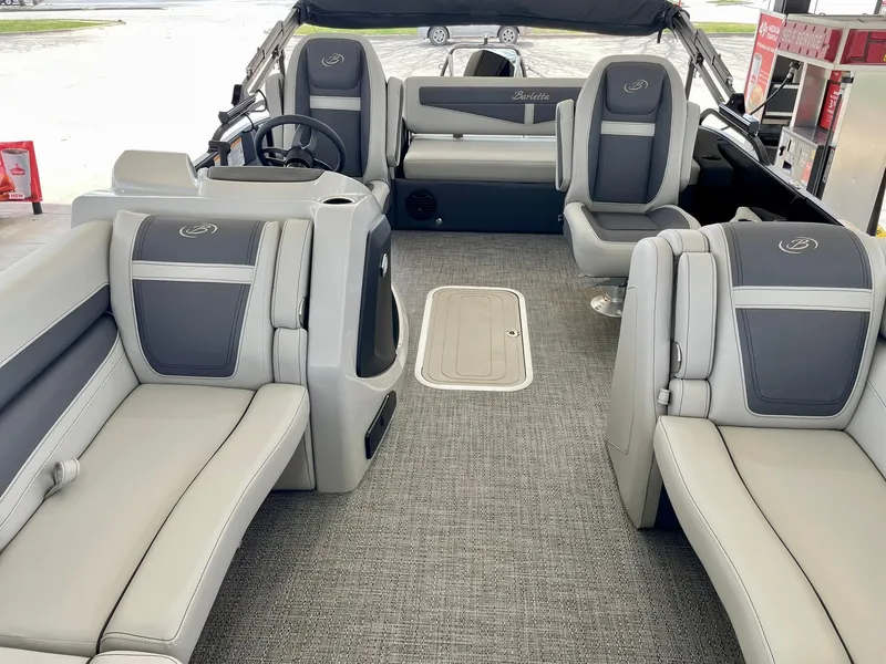 Slide: The Image of 2024 Barletta Cabrio 22UC pontoon boat interior with luxurious seating and modern design. - 33