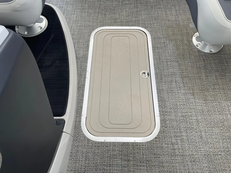 Slide: The Image of 2024 Barletta Cabrio 22UC boat interior with storage compartment. - 36