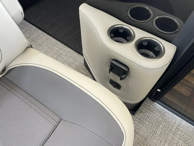 Slide: The Image of Barletta Cabrio 22UC 2024 boat interior with cup holders and seating. - 37