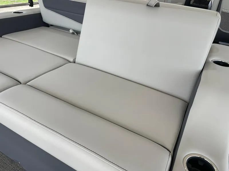 Slide: The Image of 2024 Barletta Cabrio 22UC boat interior seating with cup holders. - 40